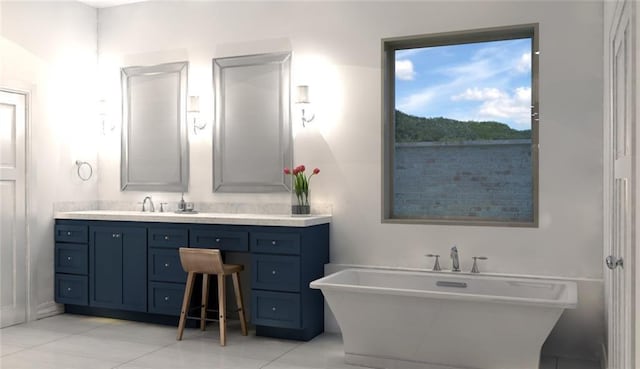 bathroom featuring a freestanding tub, vanity, and tile patterned flooring
