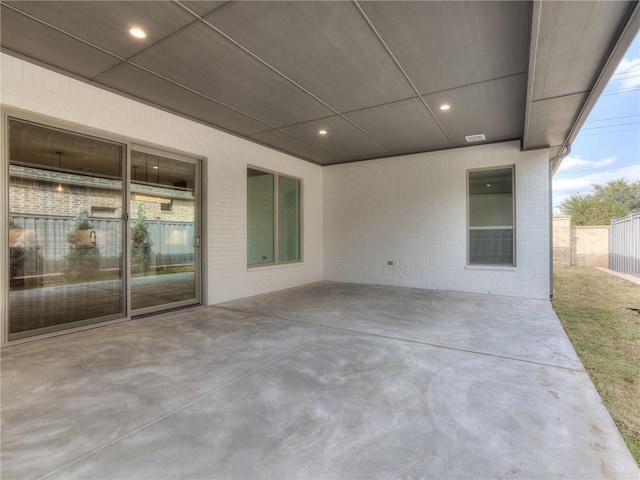 view of patio featuring fence and visible vents