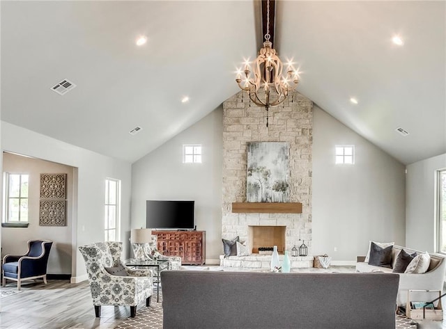 living room featuring a wealth of natural light and high vaulted ceiling