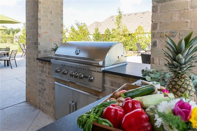 view of patio featuring fence and area for grilling