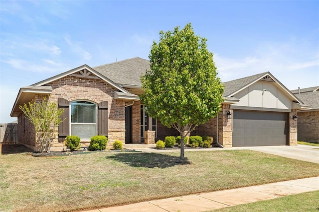 9233 SW 48th Ter, Oklahoma City, OK 73179 - view of front of home featuring brick siding, an attached garage, and a shingled roof