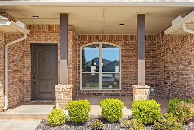 9233 SW 48th Ter, Oklahoma City, OK 73179 - view of exterior entry with brick siding and covered porch
