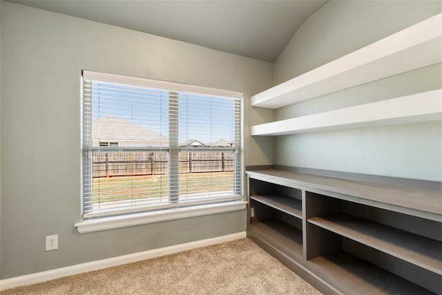 9233 SW 48th Ter, Oklahoma City, OK 73179 - home office with baseboards, light colored carpet, and lofted ceiling