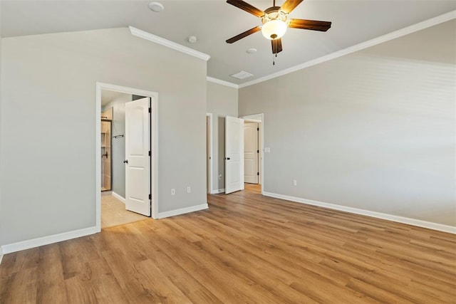 9233 SW 48th Ter, Oklahoma City, OK 73179 - unfurnished bedroom featuring light wood-type flooring, ensuite bath, ornamental molding, lofted ceiling, and baseboards