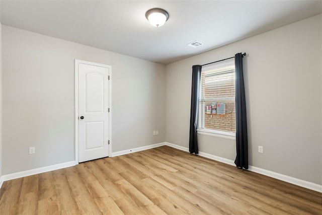 9233 SW 48th Ter, Oklahoma City, OK 73179 - empty room with light wood-style flooring, baseboards, and visible vents