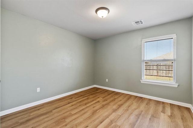 9233 SW 48th Ter, Oklahoma City, OK 73179 - empty room featuring visible vents, baseboards, and light wood finished floors