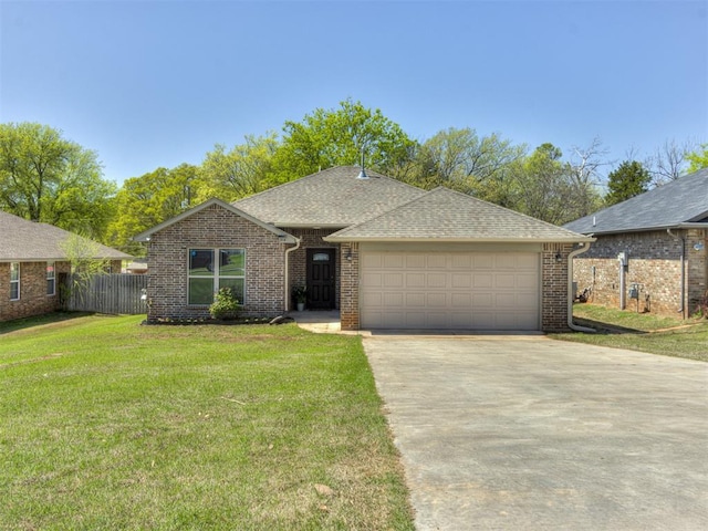 ranch-style house with brick siding, driveway, an attached garage, and a front lawn