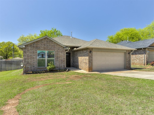 single story home featuring brick siding, a front yard, a garage, and concrete driveway