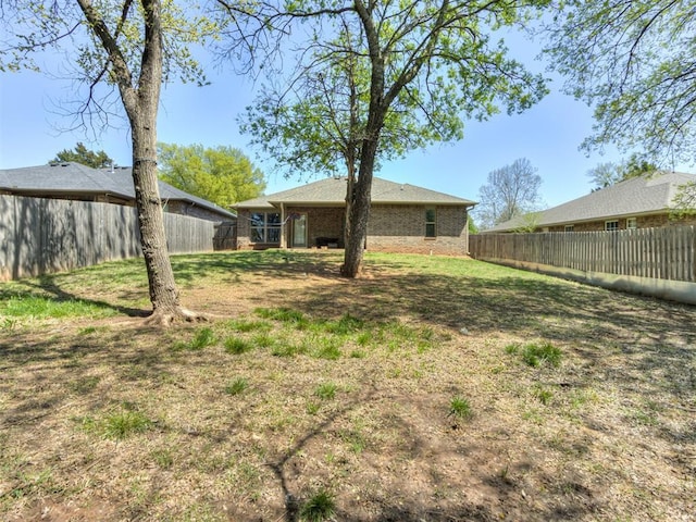 view of yard featuring a fenced backyard