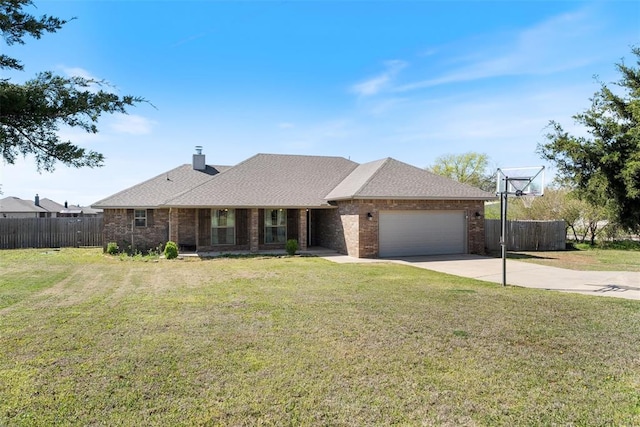 single story home with a front yard, fence, a garage, and concrete driveway