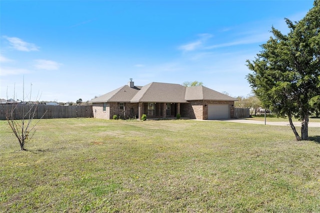 single story home with concrete driveway, a garage, a front yard, and fence