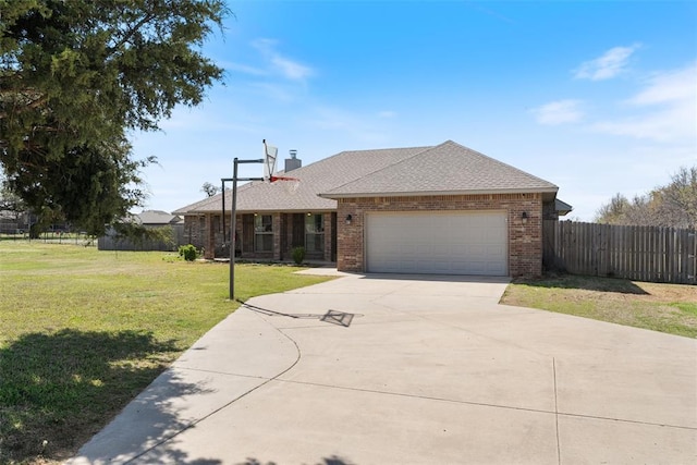 ranch-style home with an attached garage, driveway, a front yard, and brick siding
