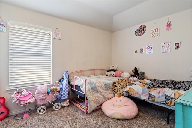 bedroom featuring carpet and lofted ceiling