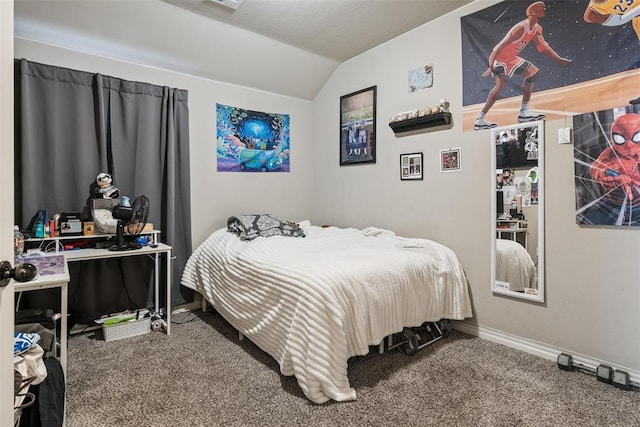 carpeted bedroom with baseboards and vaulted ceiling