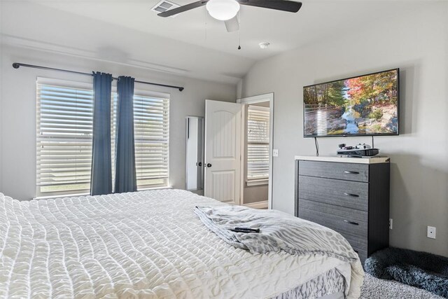 bedroom with visible vents, ceiling fan, and lofted ceiling