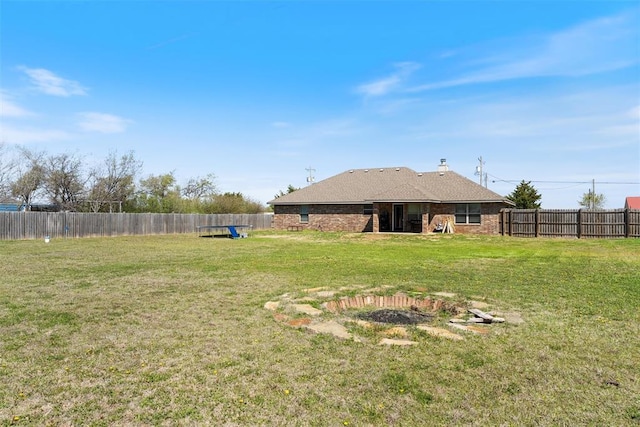 view of yard with a fenced backyard