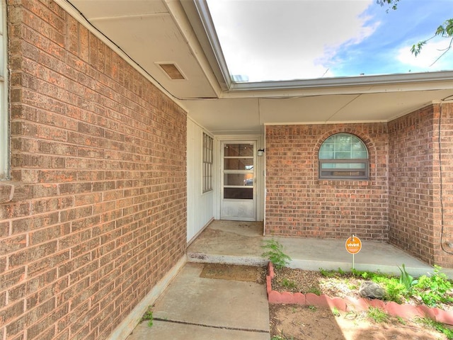 901 Richmond St, Yukon, OK 73099 - view of exterior entry featuring brick siding