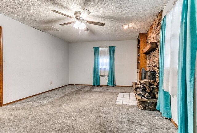 901 Richmond St, Yukon, OK 73099 - unfurnished living room with ceiling fan, baseboards, carpet flooring, and a textured ceiling