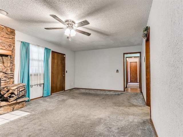 901 Richmond St, Yukon, OK 73099 - empty room featuring a ceiling fan, baseboards, carpet, and a textured ceiling