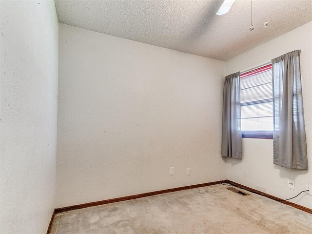 901 Richmond St, Yukon, OK 73099 - carpeted empty room featuring baseboards, a textured ceiling, and visible vents