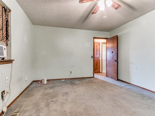 901 Richmond St, Yukon, OK 73099 - spare room with carpet floors, a textured ceiling, a ceiling fan, and baseboards