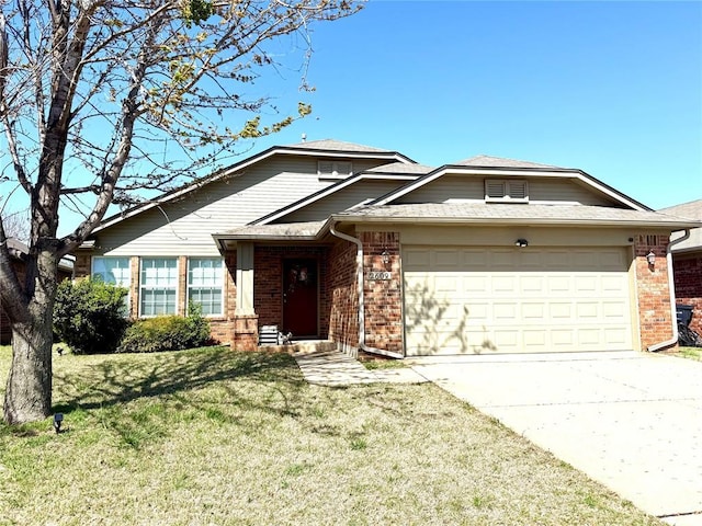 single story home featuring brick siding, a front yard, a garage, and concrete driveway