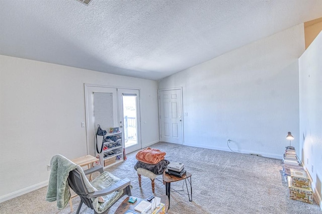 3003 River Oaks Dr Unit 215, Norman, OK 73072 - sitting room with carpet flooring, a textured ceiling, and baseboards