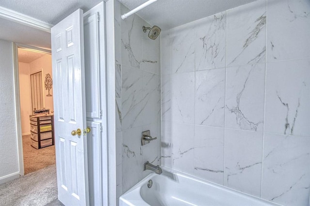 3003 River Oaks Dr Unit 215, Norman, OK 73072 - full bathroom featuring a textured ceiling and shower / tub combination
