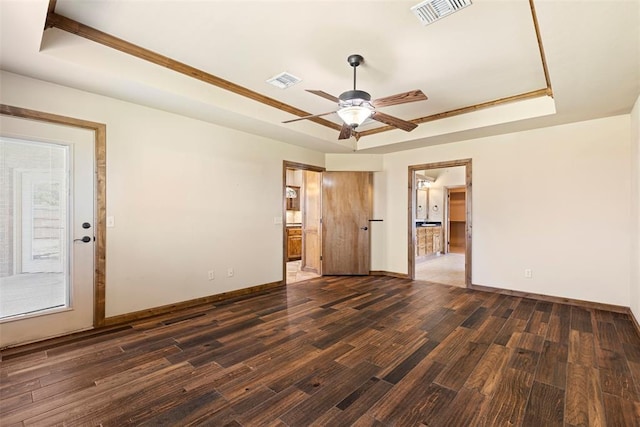 18395 Wild Horse Trl, Norman, OK 73072 - unfurnished bedroom with a raised ceiling, wood finished floors, and visible vents
