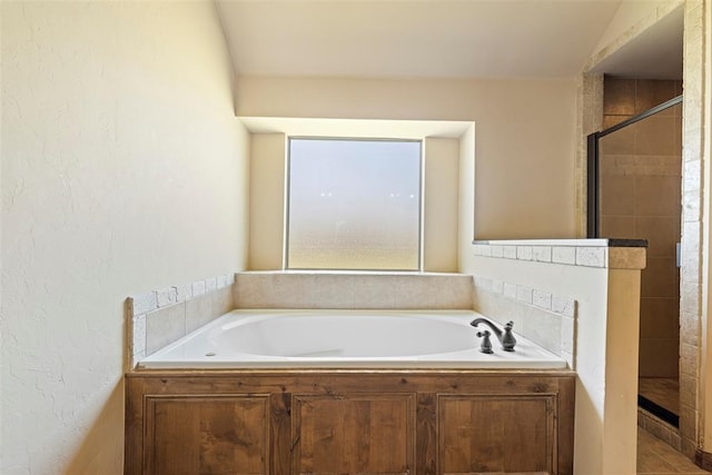 18395 Wild Horse Trl, Norman, OK 73072 - full bathroom with a shower stall, a textured wall, and a garden tub