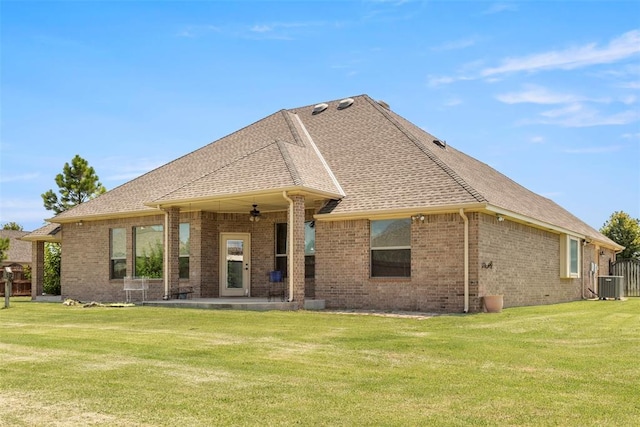 18395 Wild Horse Trl, Norman, OK 73072 - rear view of house with roof with shingles, cooling unit, brick siding, ceiling fan, and a lawn