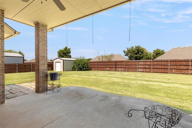18395 Wild Horse Trl, Norman, OK 73072 - view of patio / terrace with a fenced backyard, a storage unit, and an outdoor structure