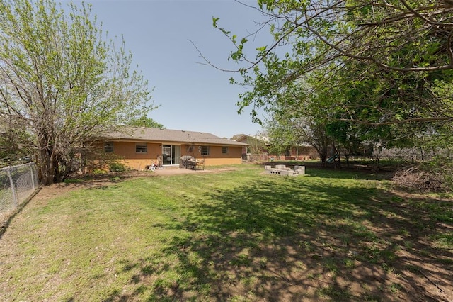 view of yard with a patio and a fenced backyard