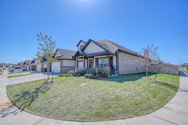 9328 NW 118th St, Yukon, OK 73099 - view of front of house featuring a front yard, brick siding, an attached garage, concrete driveway, and a residential view