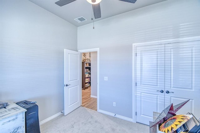 9328 NW 118th St, Yukon, OK 73099 - bedroom featuring a closet, baseboards, visible vents, ceiling fan, and carpet
