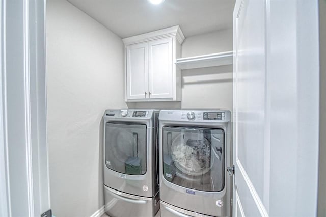 9328 NW 118th St, Yukon, OK 73099 - laundry room with separate washer and dryer, baseboards, and cabinet space