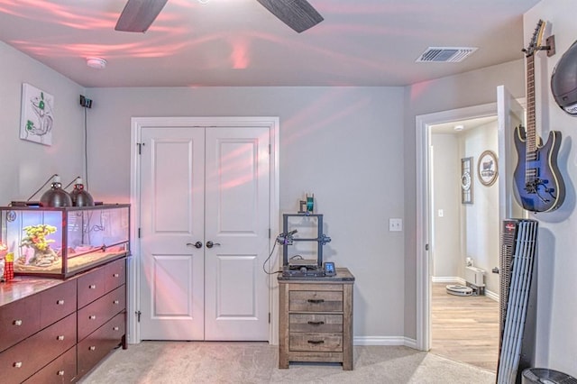 9328 NW 118th St, Yukon, OK 73099 - bedroom featuring baseboards, a closet, light carpet, a ceiling fan, and visible vents