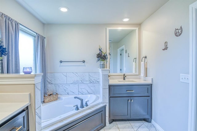 9328 NW 118th St, Yukon, OK 73099 - bathroom with a bath, marble finish floor, vanity, and recessed lighting