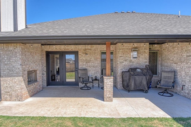 9328 NW 118th St, Yukon, OK 73099 - view of patio / terrace with grilling area and french doors