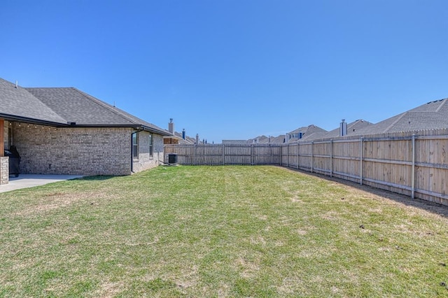 9328 NW 118th St, Yukon, OK 73099 - view of yard with a fenced backyard and central AC