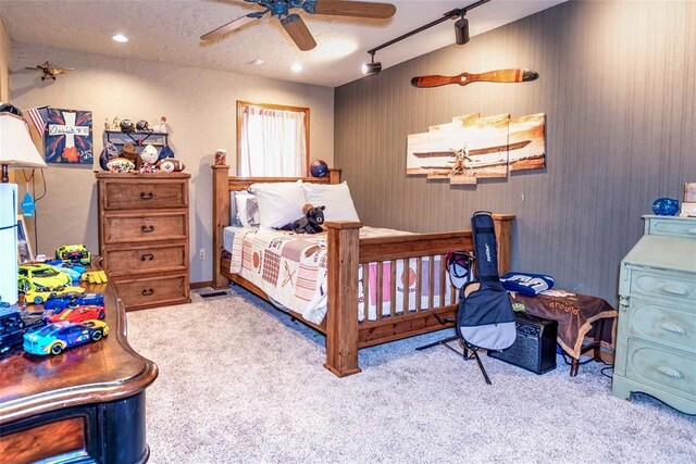 carpeted bedroom featuring rail lighting, recessed lighting, and a ceiling fan