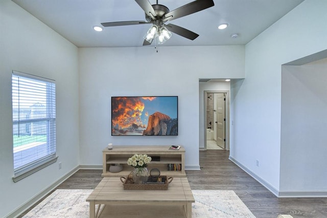 living room with wood finished floors, baseboards, ceiling fan, and recessed lighting
