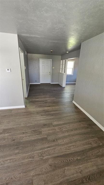 1708 NE 47th St, Oklahoma City, OK 73111 - spare room featuring baseboards and wood finished floors