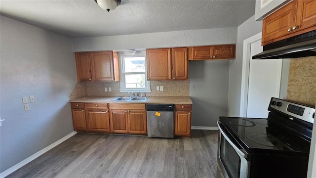 1708 NE 47th St, Oklahoma City, OK 73111 - kitchen with a sink, brown cabinets, and appliances with stainless steel finishes