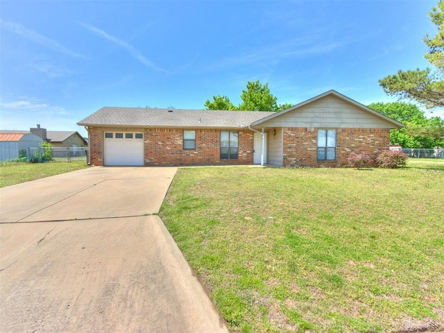 2416 Ellis Dr, Shawnee, OK 74804 - ranch-style house with a front yard, an attached garage, fence, concrete driveway, and brick siding