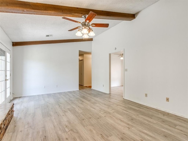 2416 Ellis Dr, Shawnee, OK 74804 - unfurnished living room featuring light wood-type flooring, vaulted ceiling with beams, and a ceiling fan