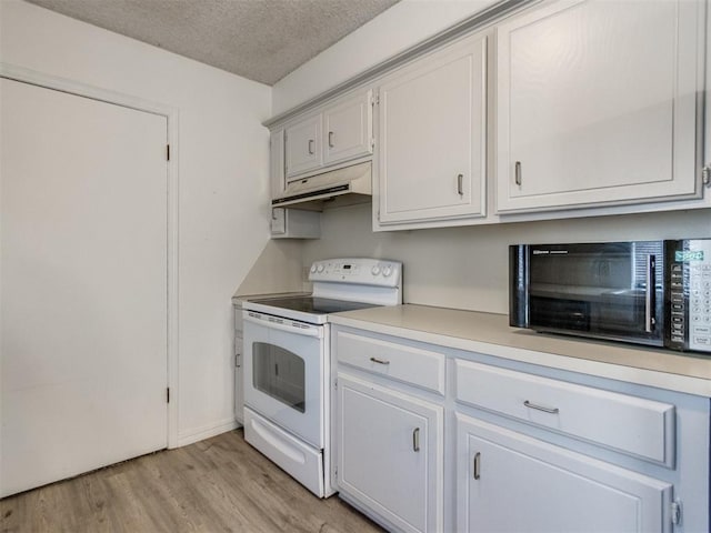 2416 Ellis Dr, Shawnee, OK 74804 - kitchen with white electric range oven, light wood-type flooring, a textured ceiling, under cabinet range hood, and light countertops