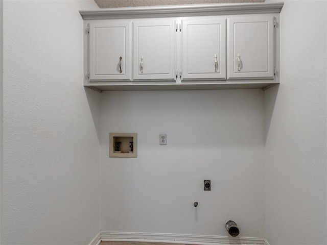 2416 Ellis Dr, Shawnee, OK 74804 - laundry room featuring hookup for an electric dryer, washer hookup, hookup for a gas dryer, baseboards, and cabinet space