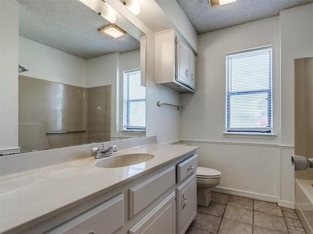 2416 Ellis Dr, Shawnee, OK 74804 - full bathroom with a textured ceiling and a wealth of natural light