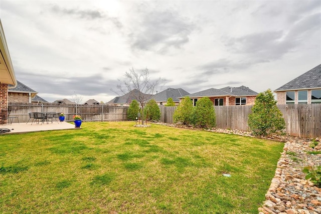 view of yard featuring a patio area and a fenced backyard